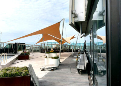 Stormproof hotel patio cover at the beach for Inntel Hotels
